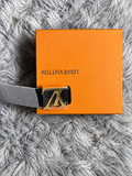 Louis Vuitton–branded statement belt